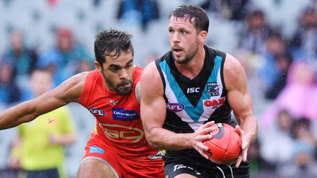 Port Adelaide star Travis Boak has re-committed to the club until the end of 2022.