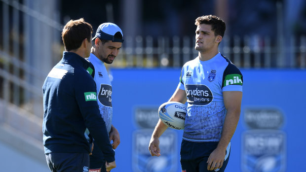 Tips from the top: Halfback of the Century Andrew Johns works with Cody Walker and Nathan Cleary.