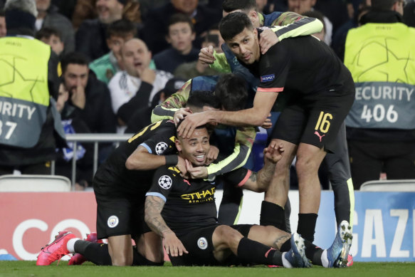 Manchester City's Gabriel Jesus celebrates with teammates after scoring their first goal against Real Madrid.