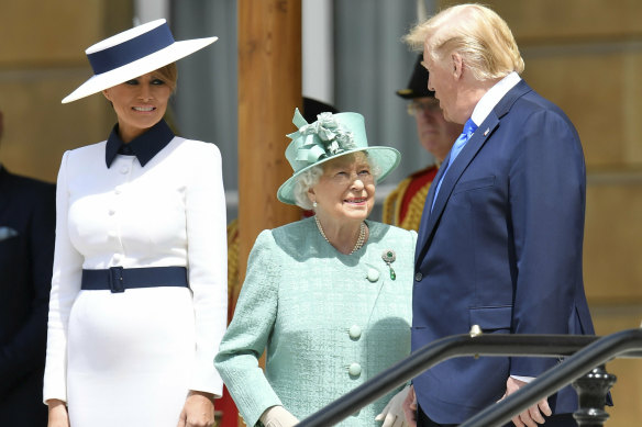 Trump and Melania attend a welcome ceremony with the Queen in the garden of Buckingham Palace.