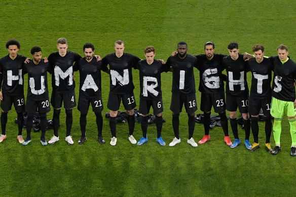 The German soccer team stage a protest at the start of their World Cup qualifier against Iceland in March.