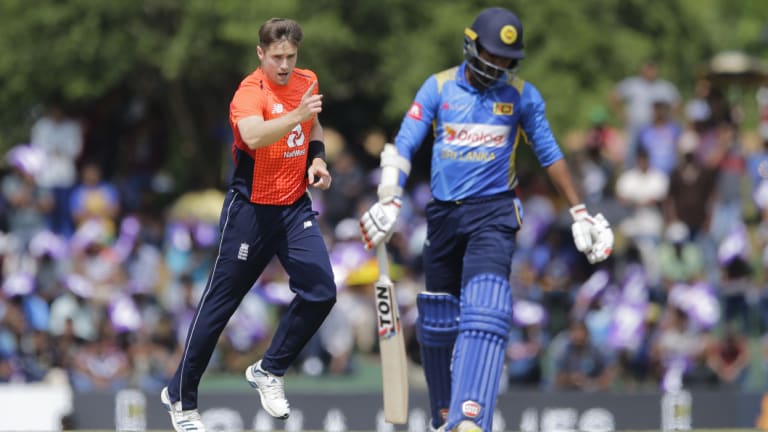 Got him: England's Chris Woakes celebrates the dismissal of Sri Lanka's Upul Tharanga.