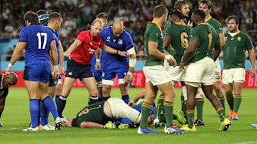 South Africa's Duane Vermeulen goes down injured after a dangerous tackle by Andrea Lovotti that led to his send-off.