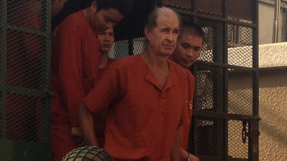 Accused Australian spy James Ricketson attends a court hearing in Phnom Penh.