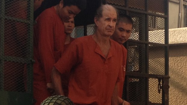 Accused Australian spy James Ricketson attends a court hearing in Phnom Penh.