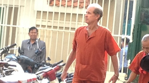 Accused Australian spy James Ricketson is led into a Cambodian court on Tuesday.