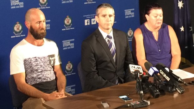 Mark Russell's son, Shane Dodds (left) and Mr Russell's sister, Julie Ann Stewart join Detective Superintendent Scott Cook to urge anyone with information about Mr Russell's killing to come forward.
