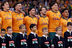 The Wallabies stand for the national anthem.