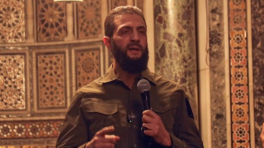 Abu Mohammad al-Golani speaks at the Umayyad Mosque in Damascus.