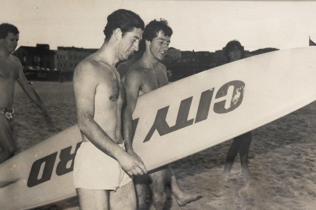 Prince Charles at Bondi in 1977, alongside a surfboard emblazoned with the name of Nick Politis’ car dealership.
