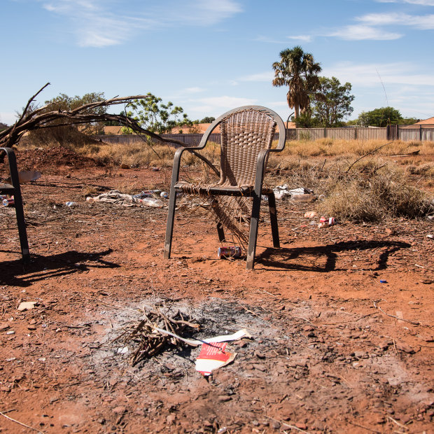 Two chairs sit by an extinguished fire in East Newman. 