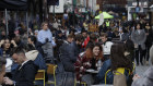 Restaurants and pubs are crowded again in London as the government eases lockdown restrictions.