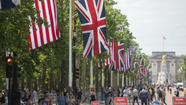 National flags of Britain and America line The Mall thoroughfare in London leading to the gilded Queen Victoria Monument standing in front of Buckingham Palace in preparation for Donald Trump's state visit.