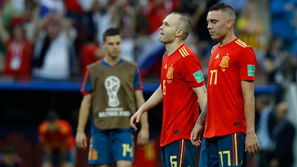 Best years gone: Andres Iniesta and Iago Aspas kiss their 2018 World Cup hopes goodbye.
