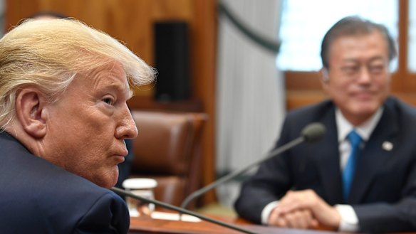 President Donald Trump and South Korean President Moon Jae-in participate in a meeting at the Blue House in Seoul on Sunday.