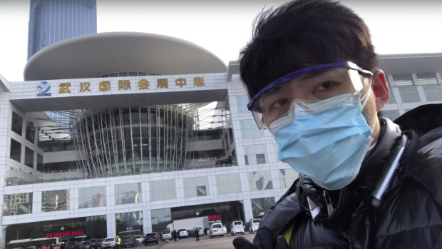 In this image from a video taken February 4, Chen Qiushi speaks in front of a convention centre-turned makeshift hospital in Wuhan.