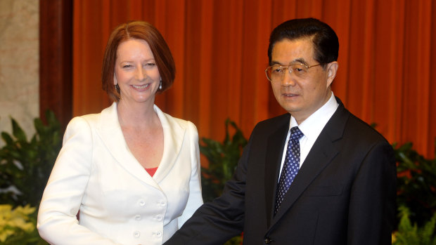 Then Australian Prime Minister Julia Gillard,  shakes hands with then Chinese President Hu Jintao at the Great Hall of the People in Beijing, China, in 2011.