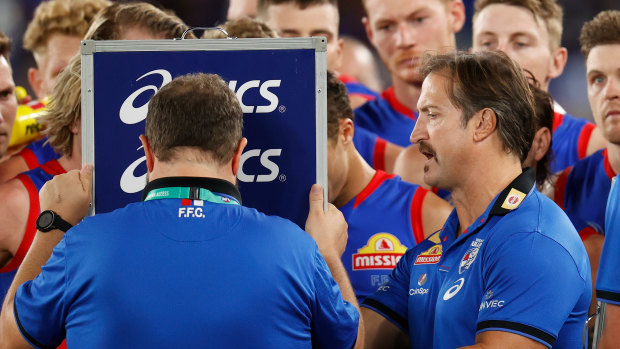 Luke Beveridge during a Western Bulldogs huddle in the match against North Melbourne on Good Friday.
