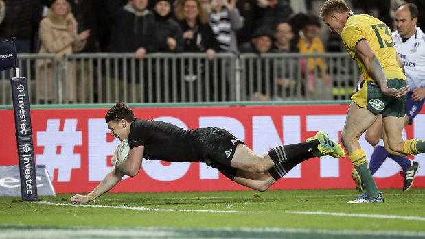 Outclassed: Beauden Barrett outruns Reece Hodge to score during last year's Bledisloe Cup match in Auckland. 