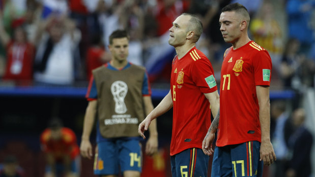 Best years gone: Andres Iniesta and Iago Aspas kiss their 2018 World Cup hopes goodbye.