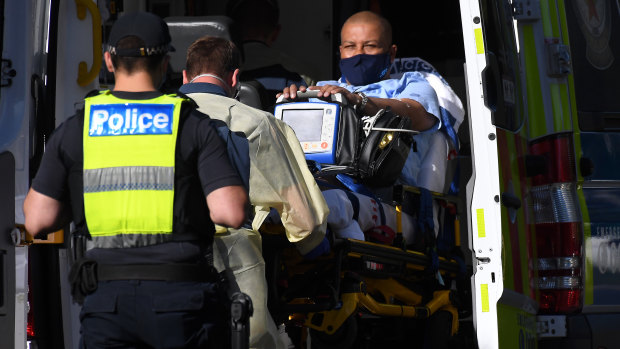 Carlos Bernardes is taken away in an ambulance from his hotel.