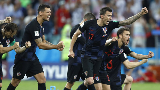 Croatia players celebrate winning the penalty shootout.