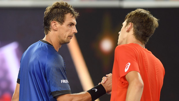 Alex de Minaur shakes hands with Henri Laaksonen of Switzerland after winning the match.