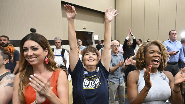 People cheer during a primary watch party in Overland Park, Kansas.  Voters in the state rejected a conservative in-state ballot measure with deep ties to the anti-abortion movement.