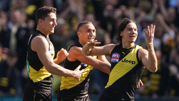 Daniel Rioli (right) signals 44 in honour of his cousin Willie, who has been provisionally suspended.