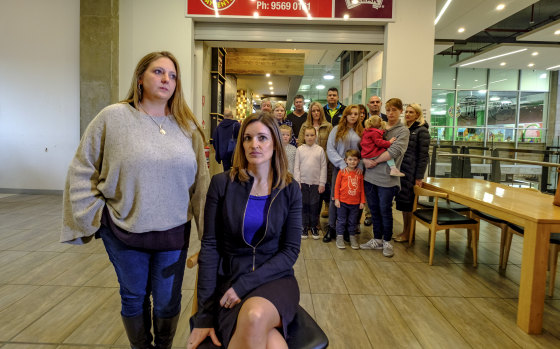 Croc's franchisee Stacey Dowsett and lawyer Prue Greenfield outside the Croc's Playcentre in Carnegie with other franchisees and their families. 