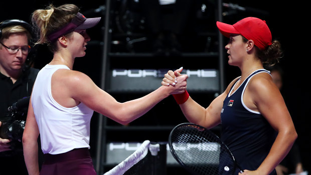 Title honours: Ashleigh Barty is congratulated by Elina Svitolina after winning the WTA Finals.