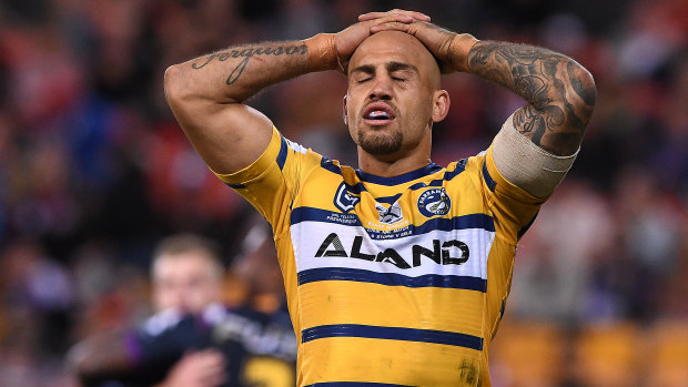 Old-fashioned hiding: Blake Ferguson reacts following another Storm try.