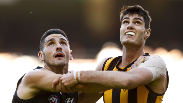 Pittonet (pictured left competing against Ned Reeves) played seven games for Hawthorn in his previous AFL life.