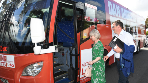 Victorian Premier Daniel Andrews and wife Catherine Andrews board the Labor bus in Noble Park on Wednesday.