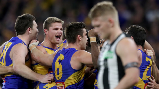 Last time: Adam Treloar in the foreground as West Coast celebrate.