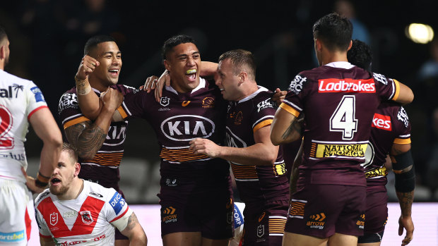 TC Robati (centre) celebrates after scoring a try against the St George Illawarra Dragons in Sydney on June 3.