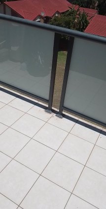 The hip-high balcony barriers that the toddler was able to climb over. 