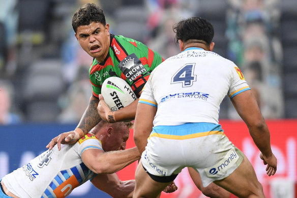 Latrell Mitchell is tackled by Tanah Boyd.