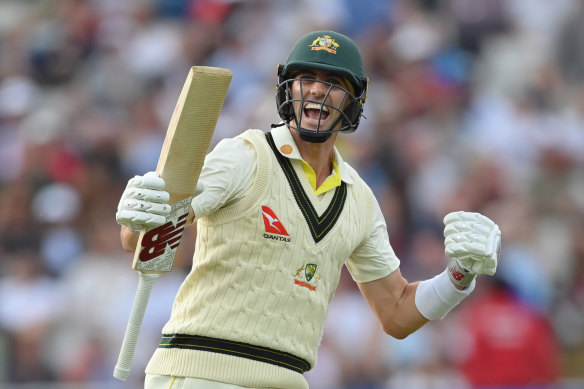 Pat Cummins celebrates after scoring the winning runs to defeat England.