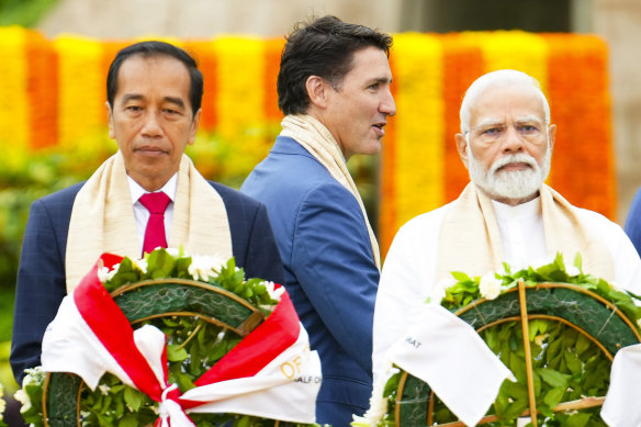 Canada’s Prime Minister Justin Trudeau (centre) walks past India’s Prime Minister Narendra Modi (right) and Indonesia’s President Joko Widodo during the G20 Summit in New Delhi.