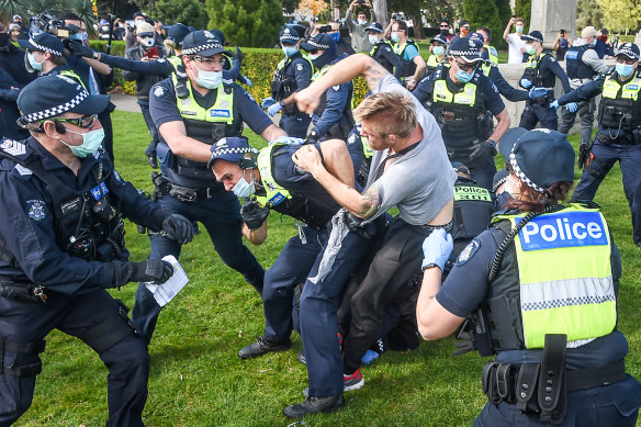A police officer and protester scuffle on Saturday.