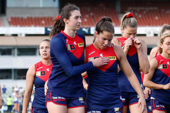 A dejected Alyssa Bannan (left) and Kate Hore after the Demons’ recorded back-to-back losses.