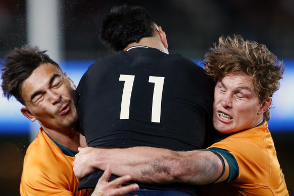 Jordan Petaia and Michael Hooper combine to tackle Rieko Ioane.