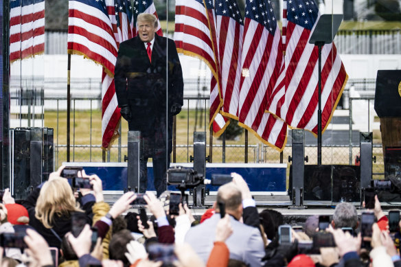 President Donald Trump addresses a rally protesting at the presidential election results on the Ellipse, with the White House in the background, in Washington on Wednesday.