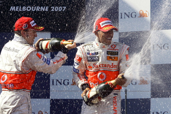 Lewis Hamilton finished third in Melbourne in 2007 and celebrates on the podium with Fernando Alonso.