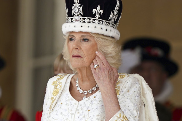 Queen Camilla, receiving a royal salute from the military in the gardens of Buckingham Palace following the May coronation.