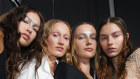 Models pose backstage at Australian Fashion Week in May 2024.