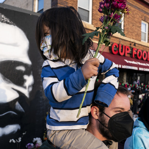 People gather outside Cup Foods in Minneapolis to celebrate the murder conviction of former police Officer Derek Chauvin in the killing of George Floyd.