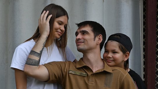 Ukrainian soldier Oleksandr Sinytskyi reunited with daughter Yaroslava, 14, and son Nikita, 9, in suburban Sydney.