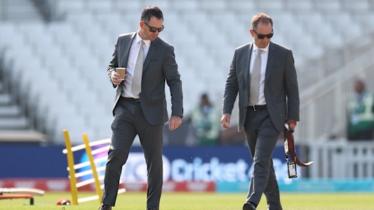 Ricky Ponting and Justin Langer inspect the pitch at the Oval during a Test match in 2023.